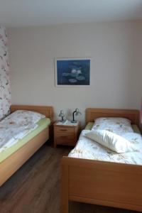 a bedroom with two beds and a picture on the wall at Apartment Gill by Interhome in Stelle +7 photos