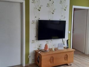a living room with a television on a wall at Apartment Gill by Interhome in Stelle