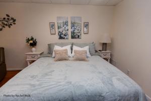 a bedroom with a large bed with two night stands at O'Brien's Sanctuary in Candler +27 photos