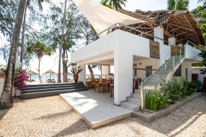 a villa with a view of the ocean at Seashore Beach hotel and Bungalow in Kumba Urembo