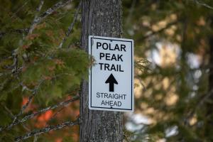 a sign on a tree that says polar peak trail at Polar Peak Lodges by Fernie Central Reservations in Fernie
