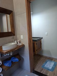 a bathroom with a sink and a mirror at Recanto Mirim in Paraty +64 photos