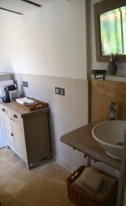 a bathroom with a sink and a counter with a sink at Les Vergers des Maures in La Garde-Freinet +18 photos