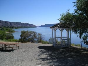 a gazebo sitting on the side of a lake at Crescent Bar Camping Resort Studio Cabin 1 in Trinidad