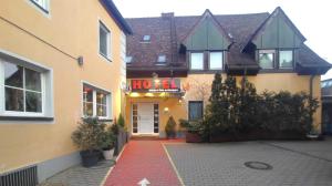 a building with a sign that reads hotel at Hotel Smart-Inn in Erlangen