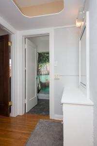 a hallway with a door leading to a living room at The Riviera in San Pedro