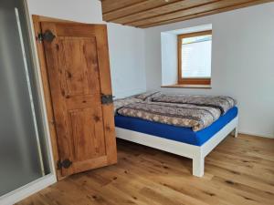 a small bedroom with a bed and a window at Apartment Günter by Interhome in Sagogn +13 photos