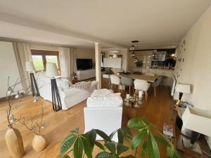 a living room with a couch and a table at Lieblingsplatz Appartement in Seelitz