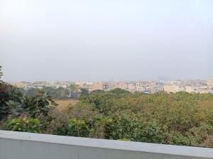a view of a city from the roof of a building at Casa Iris - One Bedroom in a 3BHK Apartment in Hyderabad