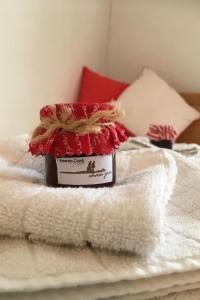 a bottle of soap sitting on top of a bed at Apartment Chasa Jaro by Interhome in Santa Maria Val Müstair +6 photos