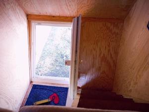 a small room with a window and a rug at Holiday Home Tiny Hause by Interhome in St. Gallen