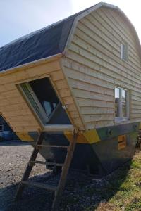 a tiny house with a roof on a trailer at Holiday Home Tiny Hause by Interhome in St. Gallen
