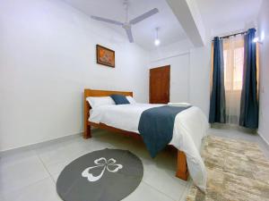 a bedroom with a large bed in a room at Njiwa suites 1034 in Mombasa