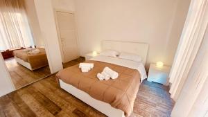 a bedroom with a bed with two towels on it at Art home Amalfi coast in Salerno