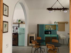 a kitchen with a table and chairs and an archway at Agriturismo Amarasca in Gagno +23 photos