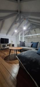 a living room with a couch and a coffee table at Villa Ulutawu in Le François