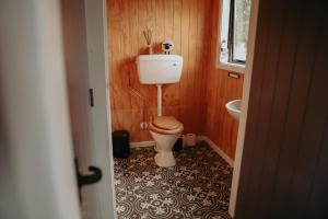 a bathroom with a toilet and a sink at Kay Bell in Masterton