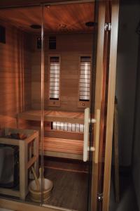 a room with a sauna with two windows at AHAVA Spa Residence in Žabljak +15 photos