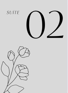 a black and white drawing of a number with flowers at Suites da Bela 02 Caparaó in Caparaó Velho