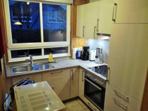 a small kitchen with a sink and a window at Holiday Home Lea by Interhome in Bremke
