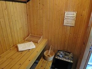 a wooden sauna with a bench and a sign at Holiday Home Lea by Interhome in Bremke +8 photos
