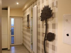 a bathroom with a shower head on the wall at Apartment Mia by Interhome in Fritzlar