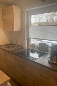 a kitchen with a sink and a counter top at Apartment Becker by Interhome in Bad Neuenahr-Ahrweiler