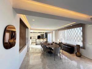 a dining room with a table and chairs at Rhode Luxury Villa in Kalithies