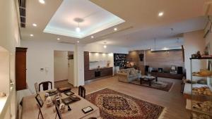 a large living room with a table and a couch at Seaview Villa Theologos in Theologos