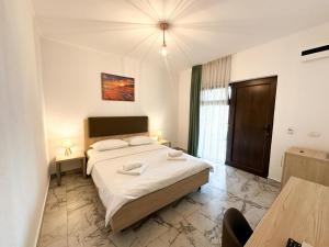 a bedroom with a large bed in a room at Casa Giulia in Vama Veche