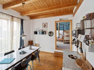 a kitchen and dining room with a table and chairs at Apartment Spiegl by Interhome in Waizacker