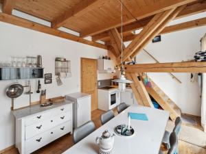 a kitchen and dining room with a table and chairs at Apartment Spiegl by Interhome in Waizacker
