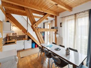 a kitchen and dining room with a table and chairs at Apartment Spiegl by Interhome in Waizacker
