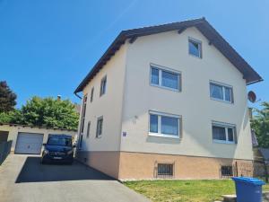 a car parked in front of a house at Apartment Lusen by Interhome in Frauenau