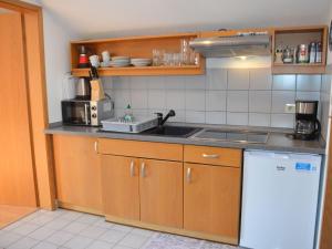 a kitchen with a sink and a counter top at Apartment in Berghäuser by Interhome in Grafenwiesen