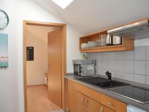 a kitchen with a sink and a counter top at Apartment in Berghäuser by Interhome in Grafenwiesen
