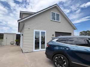 a car parked in front of a house at STUDIO42 in Papakura