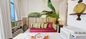 a bedroom with a bed with colorful pillows at COPSE0102 - Edifício Themis in Salvador