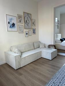 a living room with a couch and a bed at Luik city center in Liège