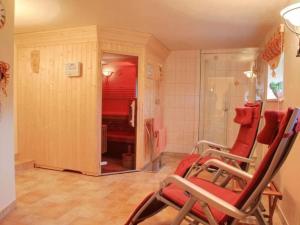 a room with two rocking chairs in a bathroom at Apartment Wiesengrund by Interhome in Neuhaus am Rennweg