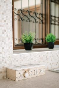 a wooden box sitting on a counter with a mirror at Rhodes Central Apartment in Rhodes Town