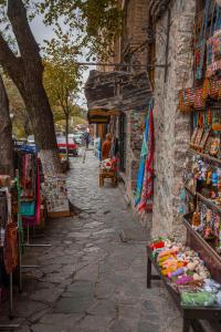 a street with a market with shops on the side of a building at Zeyzid Glamping Sheki in Sheki +84 photos