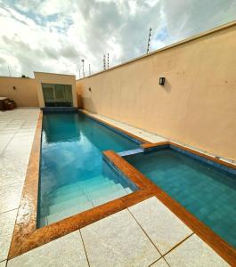a swimming pool on the side of a building at SaltBeach Salinópolis Salt Reserve in Salinópolis