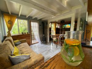 a vase on a table in a living room at Natures Balcony Reclaimed Wood Cabin with Villarrica Volcano and Majestic Peak Views in Pucón