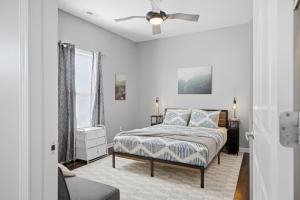 a bedroom with a bed and a ceiling fan at Sun Valley Courtyard, No Steps in Saint Joseph
