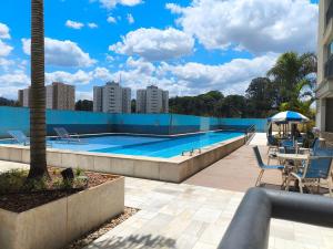 a swimming pool on the roof of a building at Studio Flat - Guarulhos -Airport Aeroporto - Bosque Maia - Cidade Maia in Guarulhos