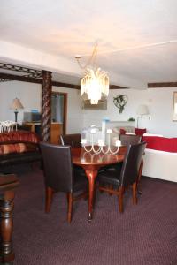 a room with a dining room table and a bed at Dakota Inn in Huron
