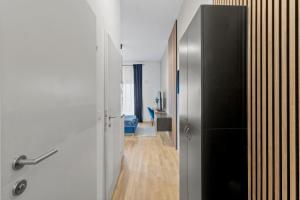 a room with a door to a room with a hallway at U1 Metro Nearby - 1-BR - fast Wi-Fi in Vienna
