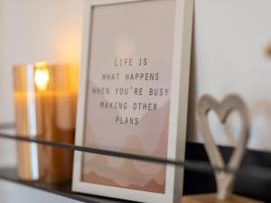 a picture frame on a shelf with a framed picture at Apartment Apartment 54 by Interhome in Bad Arolsen