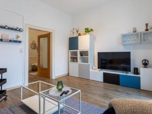 a living room with a glass coffee table and a tv at Apartment Apartment 54 by Interhome in Bad Arolsen